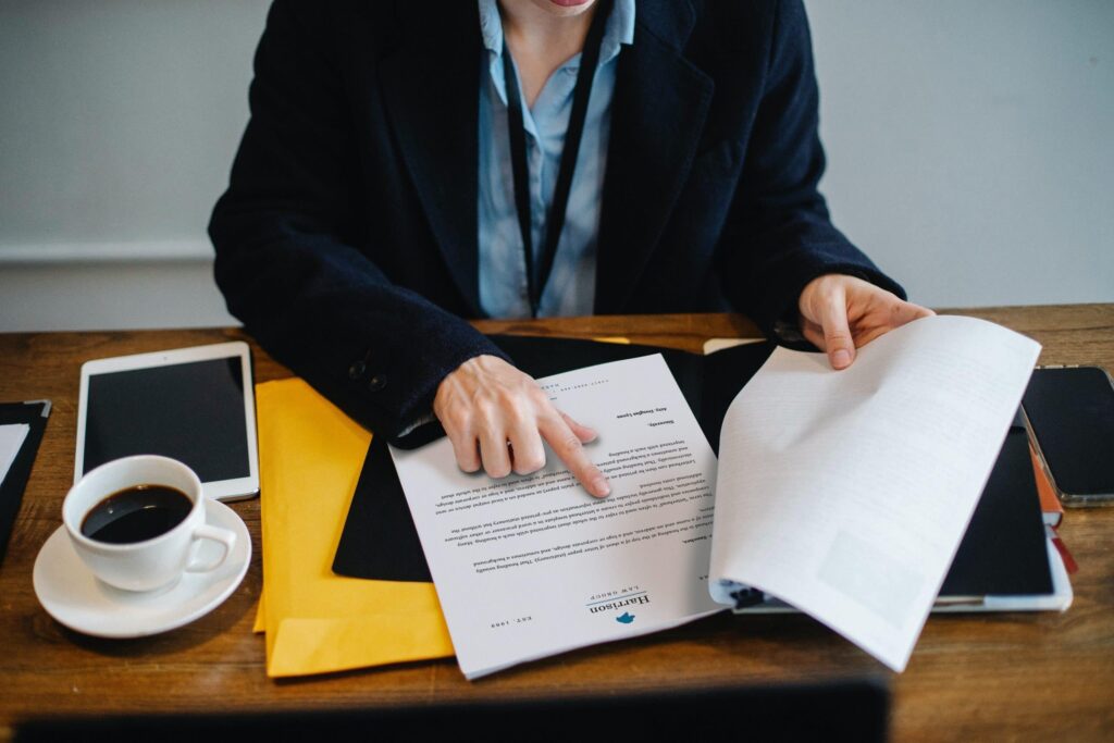 woman looking at documents about how the lemon law process works