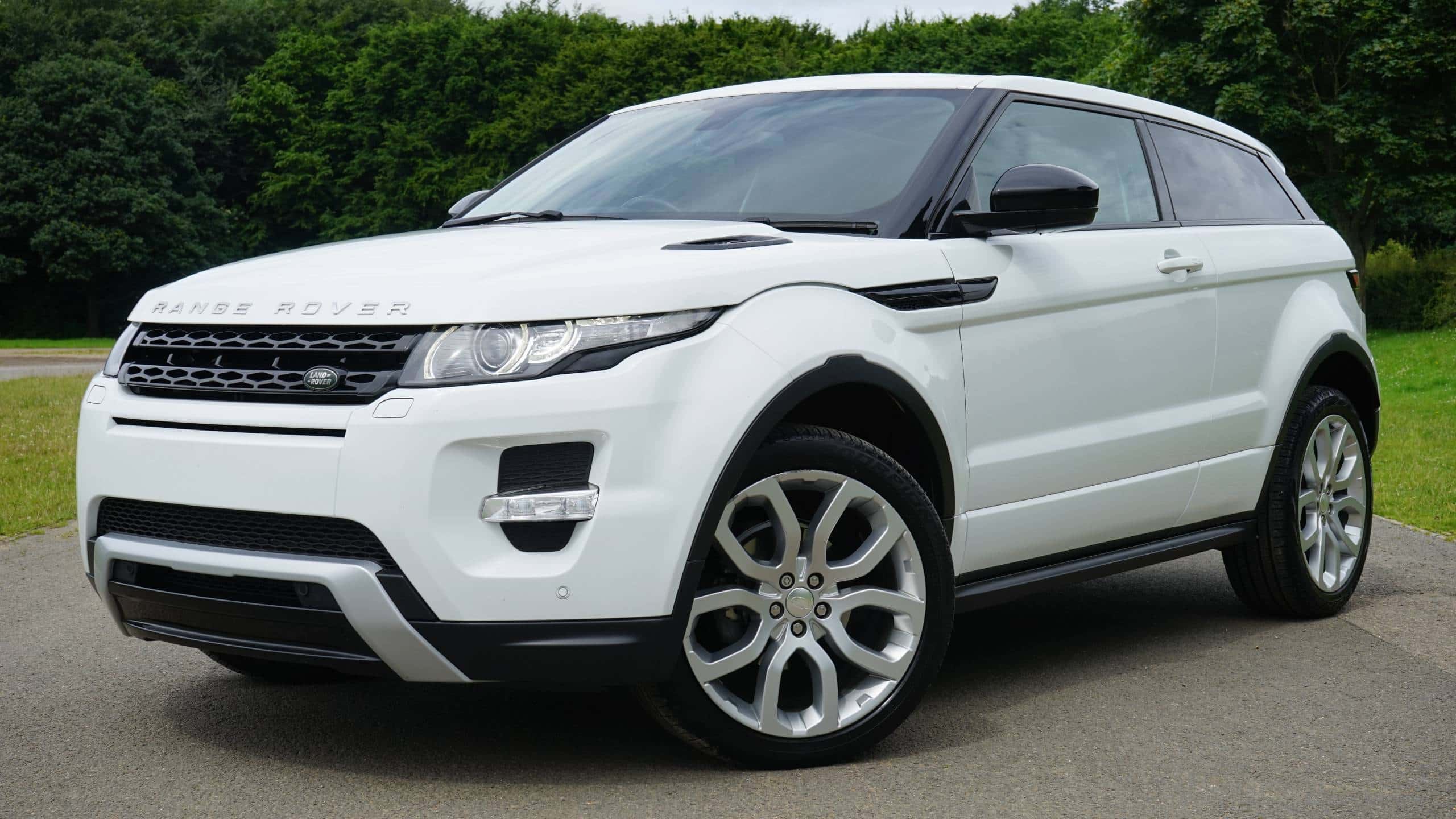 white range rover on a road