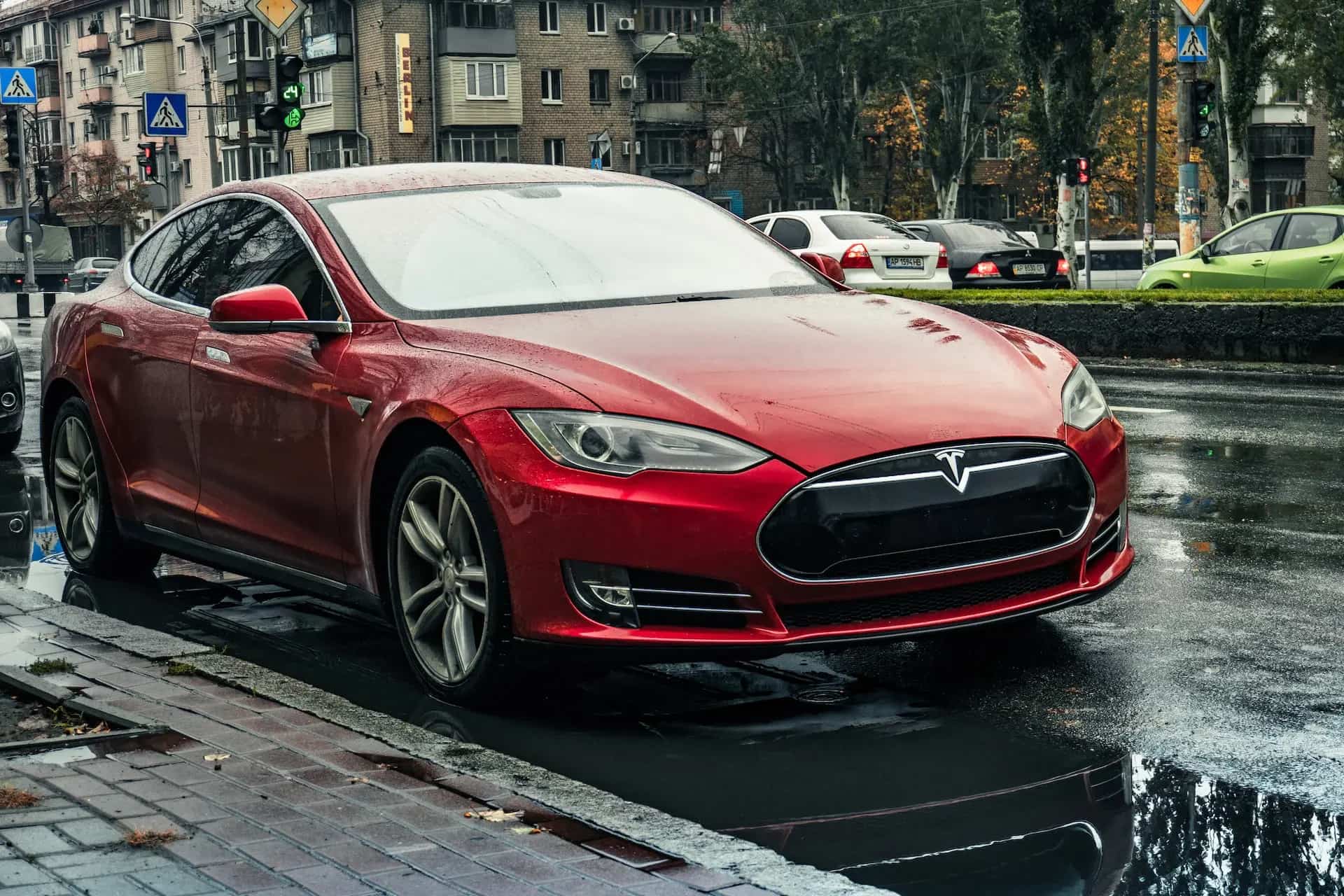 red-tesla-on-the-roadside