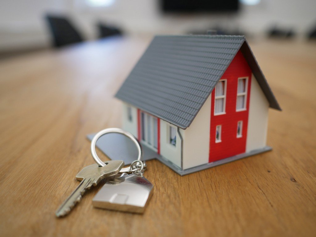 red-and-white-house-with-keys-on-a-table