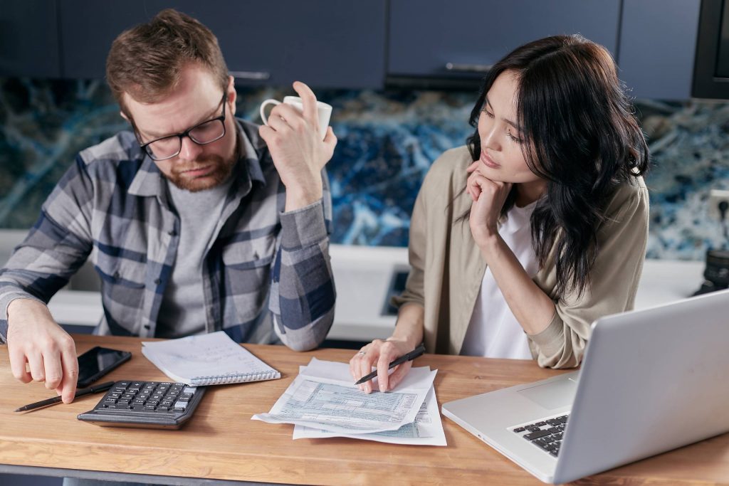 man-and-woman-looking-over-documents