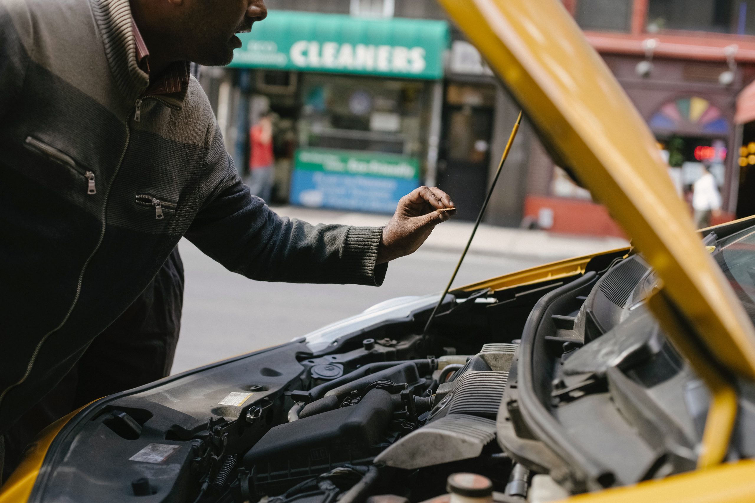 mechanic checking the inside of a car